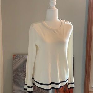 Navy and cream sweater with gold button accents